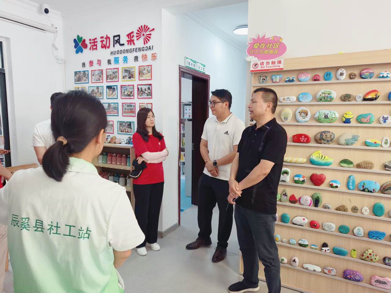 DOCOD representatives visiting the Happy Courtyard community